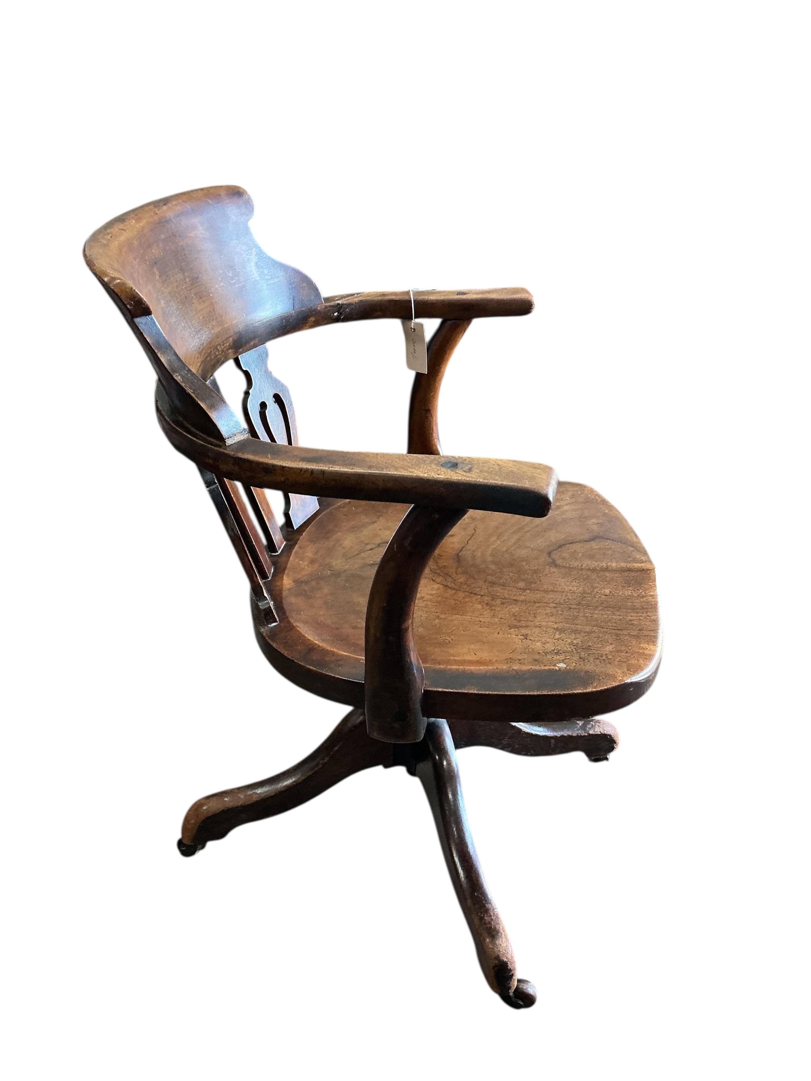 A Victorian mahogany swivel desk chair with saddle seat, width 59cm, depth 48cm, height 81cm